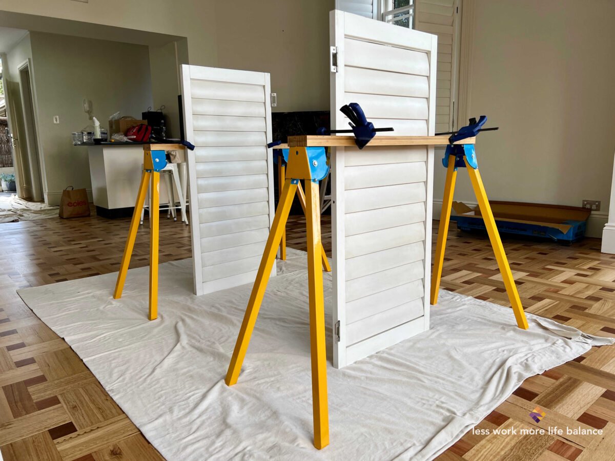 Image of plantation shutters taken off from kitchen windows to be fixed so it can be opened and closed from the hinges in home in North Sydney